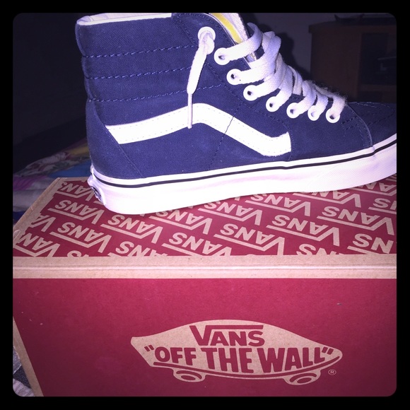navy blue and white high top vans